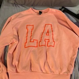 light pink LA sweatshirt